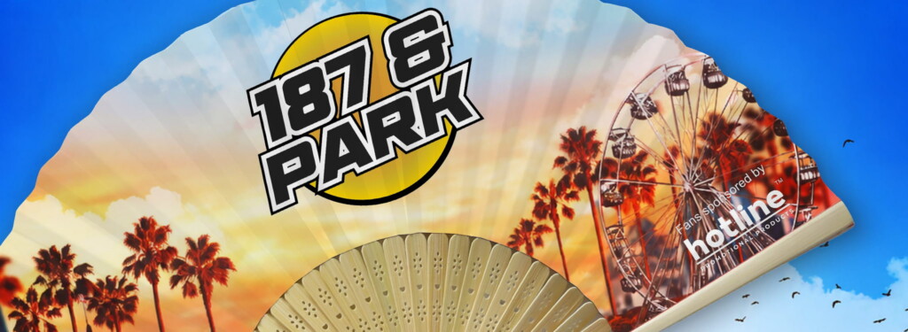 Close-up of the branded bamboo fan showing the printed design.